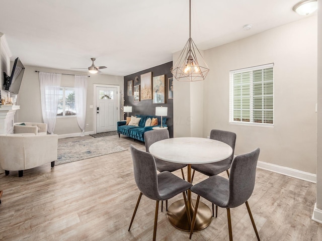 dining room featuring ceiling fan and light hardwood / wood-style floors