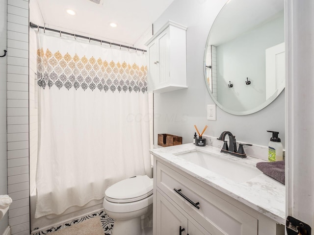 full bathroom with toilet, vanity, and shower / bath combo with shower curtain