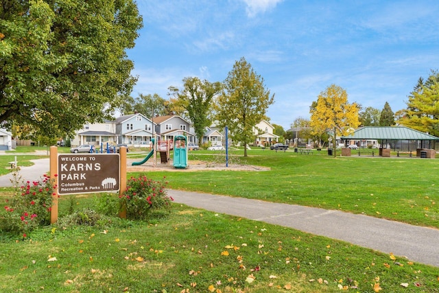 view of community with a playground, a gazebo, and a yard