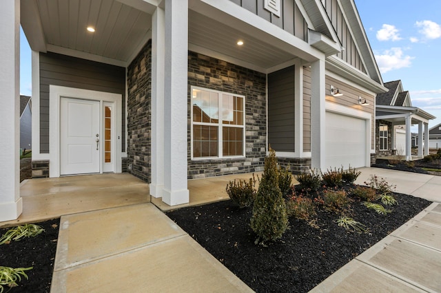 view of exterior entry featuring a porch