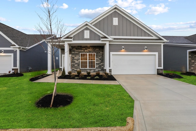 craftsman-style home featuring a front yard and a garage