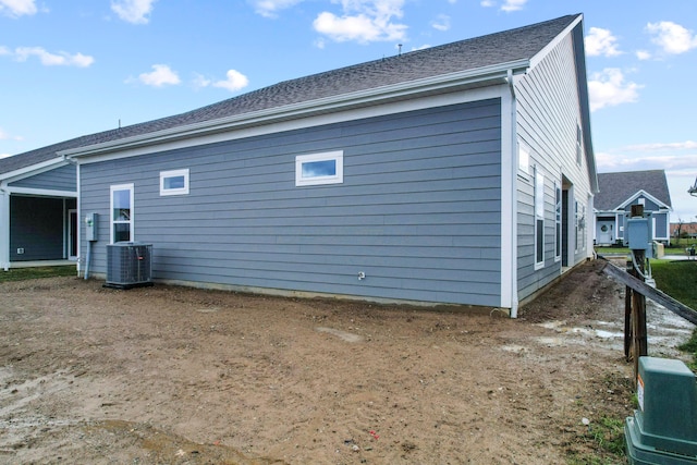 rear view of property with central air condition unit