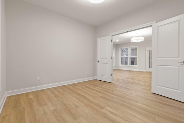 unfurnished room featuring light hardwood / wood-style floors