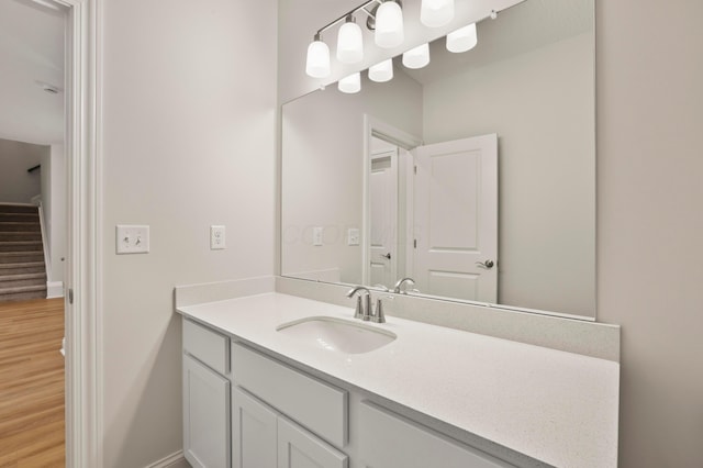 bathroom featuring vanity and hardwood / wood-style flooring