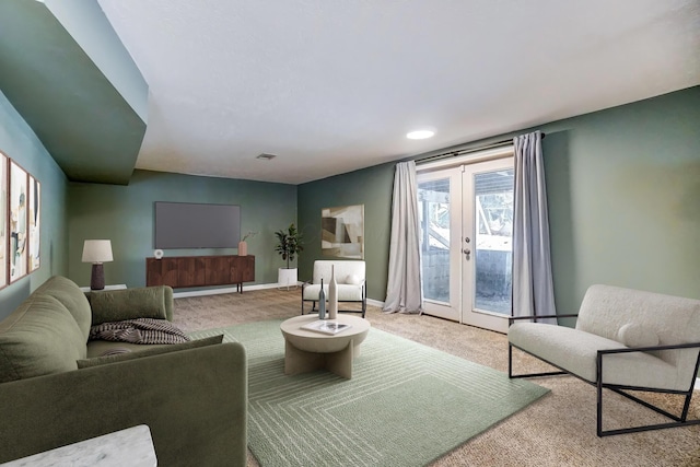 living room featuring carpet flooring and french doors