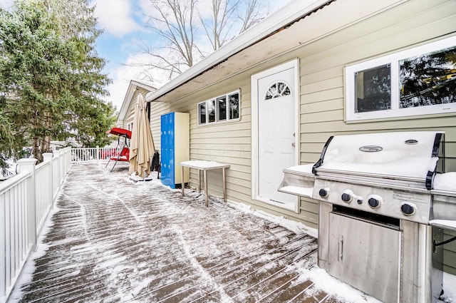 snow covered deck with area for grilling