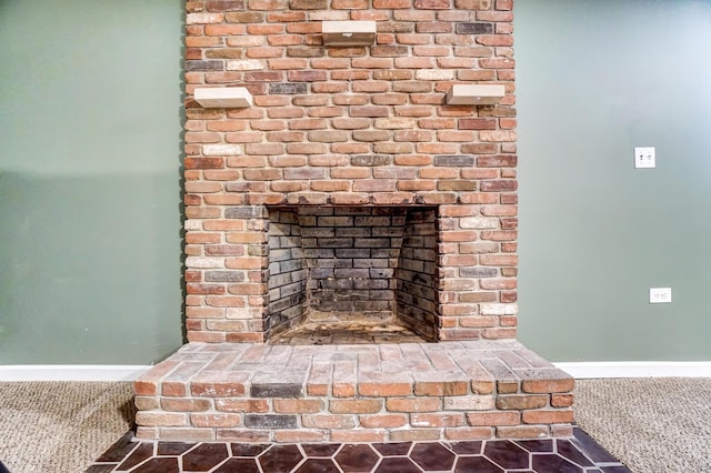 interior details featuring carpet and a fireplace