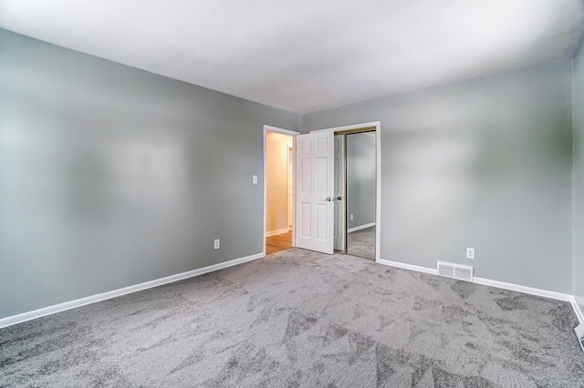 unfurnished room with carpet floors