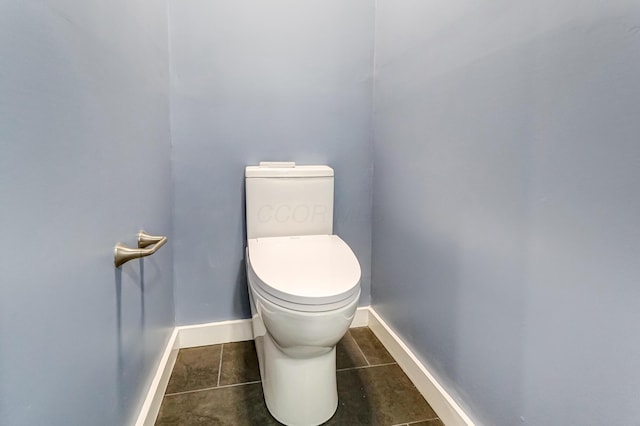 bathroom featuring tile patterned floors and toilet