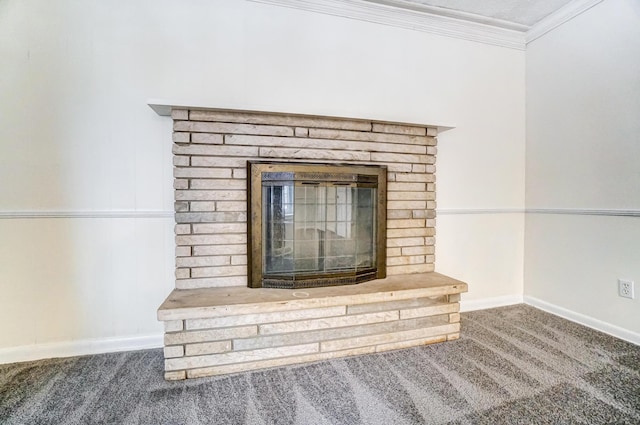 interior details featuring a fireplace, carpet, and ornamental molding