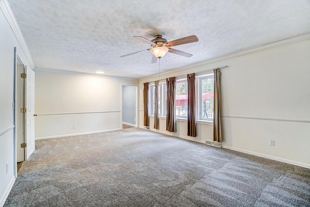 carpeted spare room with a textured ceiling, ceiling fan, and ornamental molding