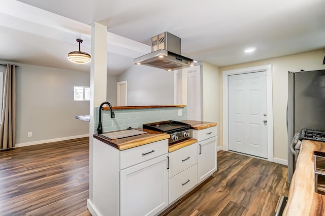 kitchen featuring hanging light fixtures, dark hardwood / wood-style floors, island range hood, white cabinetry, and stainless steel appliances