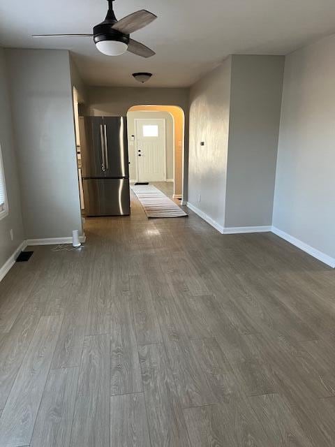 spare room with hardwood / wood-style flooring and ceiling fan