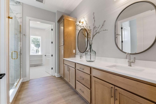 1474 Dogwood Loop, Powell, OH 43065 - full bath featuring a sink, double vanity, a stall shower, and wood finished floors