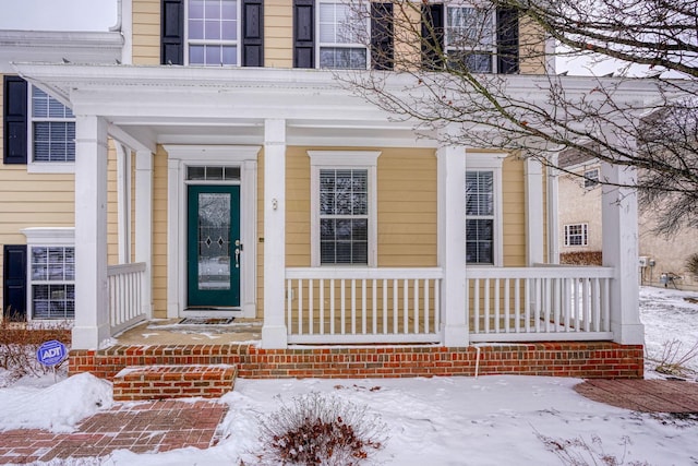 view of snow covered property entrance