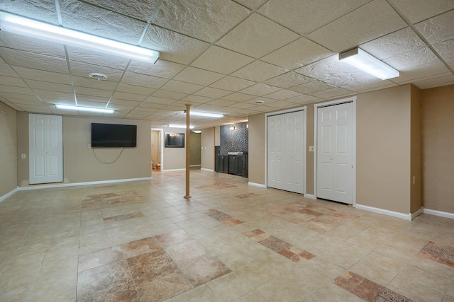 basement with a drop ceiling