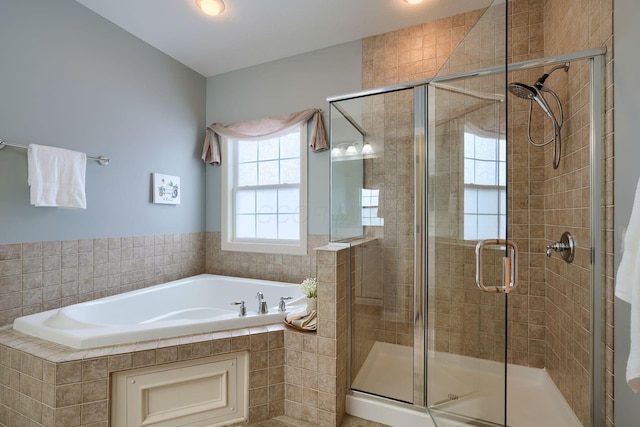 bathroom featuring plus walk in shower