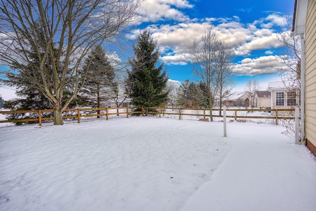 view of yard covered in snow