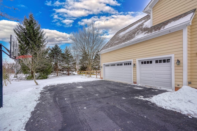 view of snow covered garage