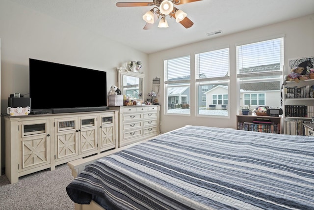 carpeted bedroom with ceiling fan