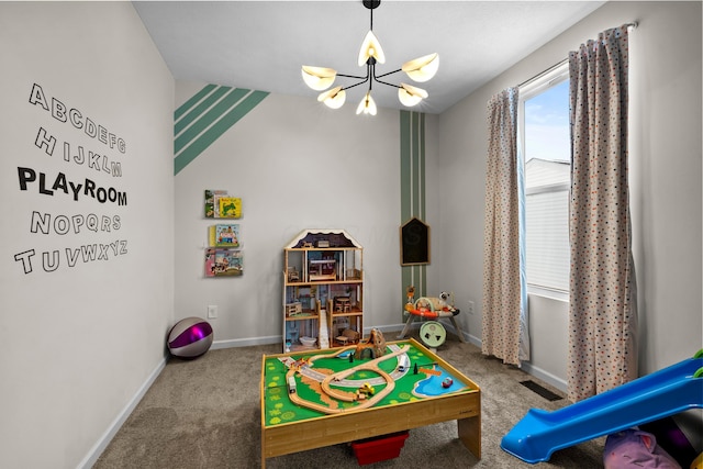 game room featuring a chandelier and carpet floors