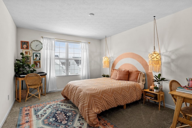 bedroom with carpet and a textured ceiling