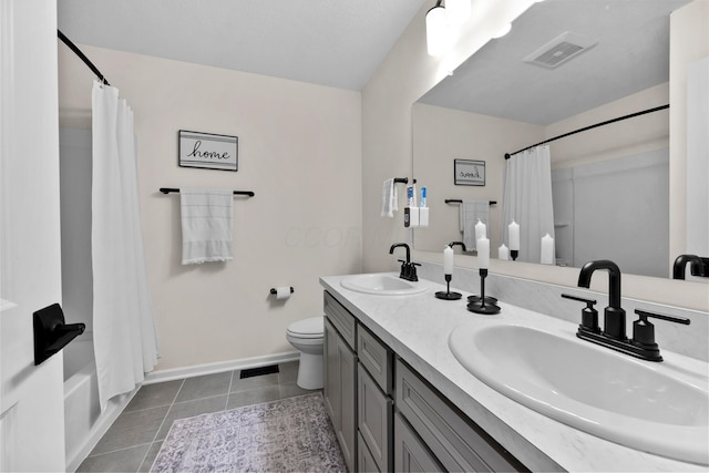 full bathroom featuring tile patterned flooring, vanity, toilet, and shower / tub combo