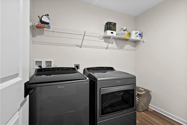 laundry room featuring dark hardwood / wood-style flooring and independent washer and dryer