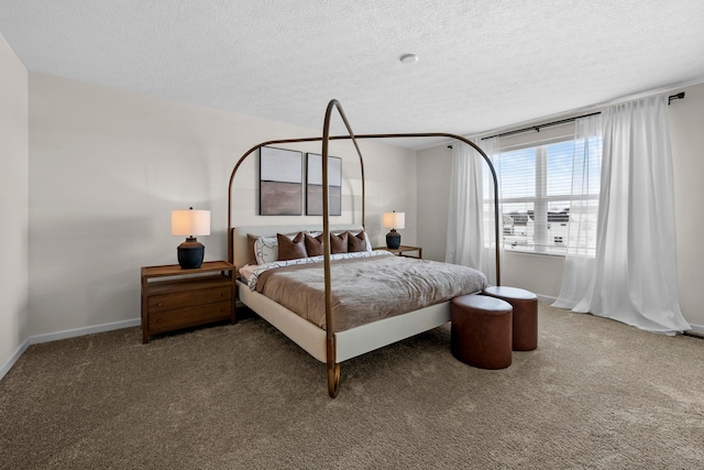 carpeted bedroom featuring a textured ceiling