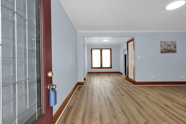 foyer entrance featuring light wood-type flooring and ornamental molding