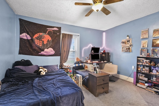 carpeted bedroom featuring a textured ceiling and ceiling fan