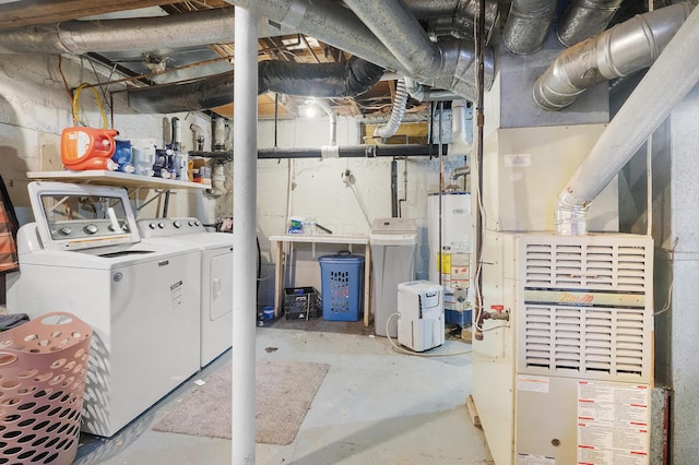 basement featuring washer and dryer and gas water heater