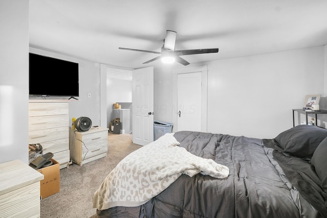 bedroom featuring ceiling fan and light carpet