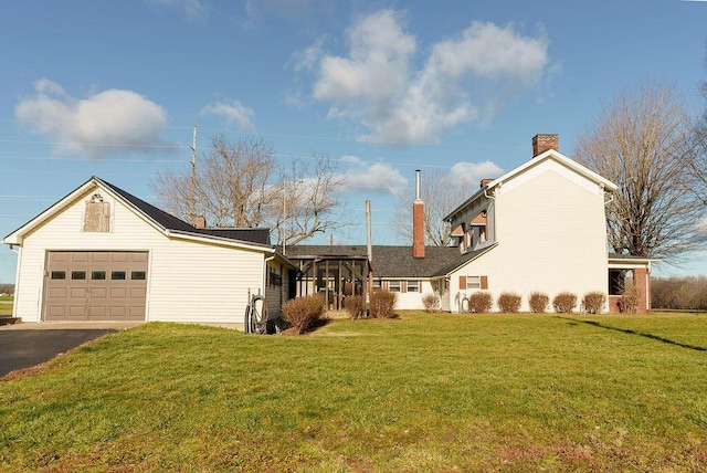 exterior space with a lawn and a garage