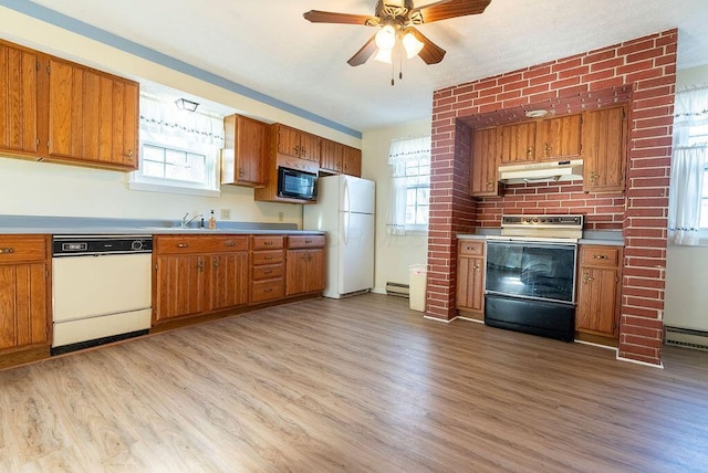 kitchen featuring ceiling fan, sink, light hardwood / wood-style flooring, a baseboard heating unit, and white appliances