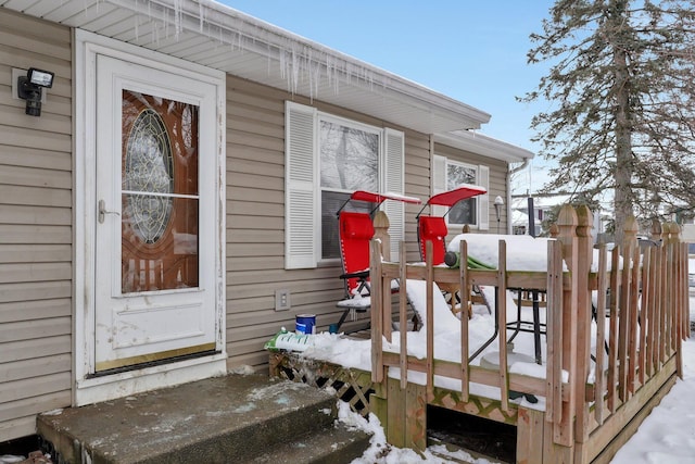 view of snow covered property entrance