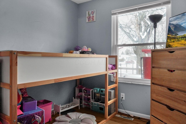 bedroom with wood-type flooring