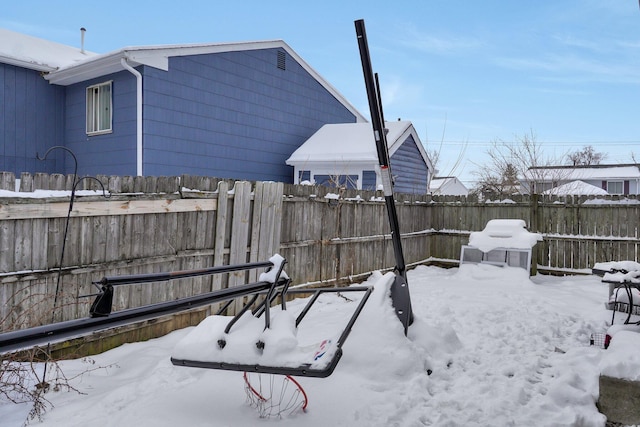 view of yard covered in snow