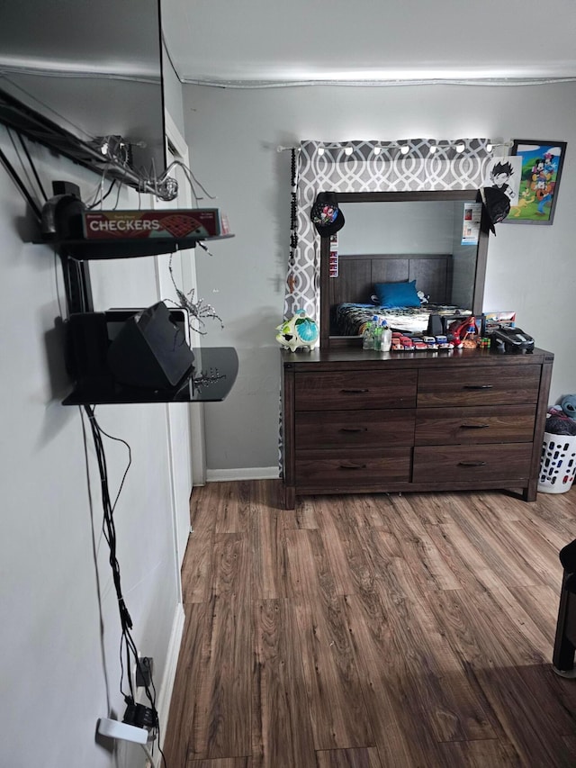 bedroom with hardwood / wood-style floors