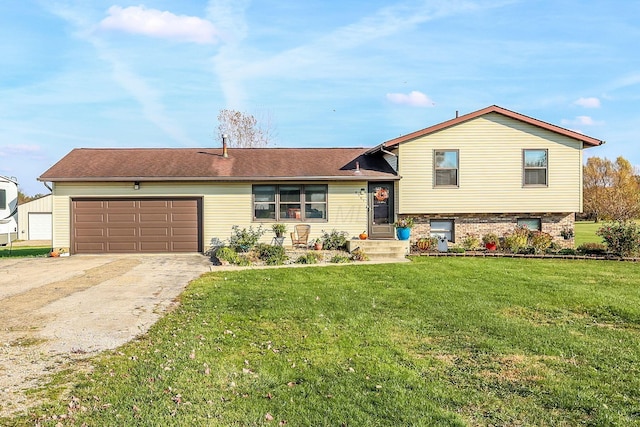 split level home featuring a garage and a front lawn