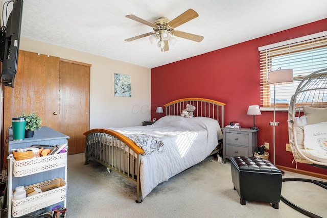 carpeted bedroom featuring ceiling fan