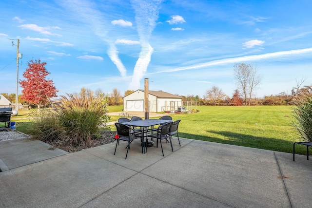 view of patio / terrace featuring an outdoor structure and a garage