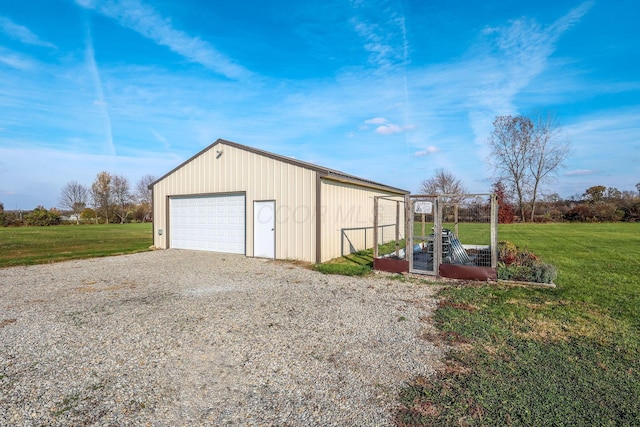 garage featuring a yard