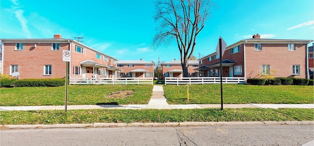 view of property's community with a yard