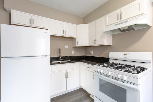 kitchen with sink, white cabinets, dark hardwood / wood-style floors, and white appliances