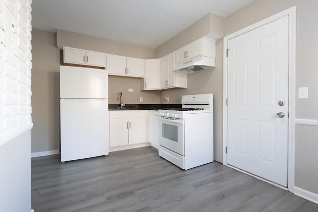 kitchen with white cabinets, white appliances, sink, and light hardwood / wood-style flooring