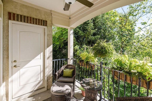 exterior space featuring a balcony and ceiling fan