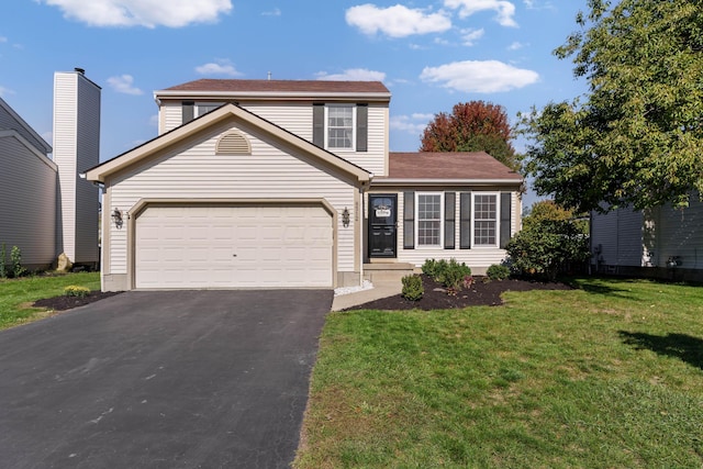 view of property featuring a garage and a front yard