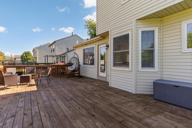 wooden deck with an outdoor living space