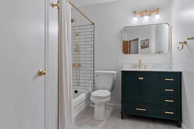 full bathroom with toilet, vanity, tiled shower / bath, and wood-type flooring